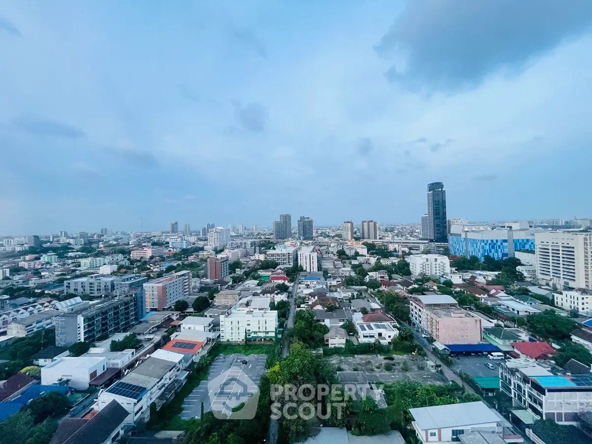 Stunning cityscape view from high-rise building showcasing urban skyline and vibrant neighborhood.