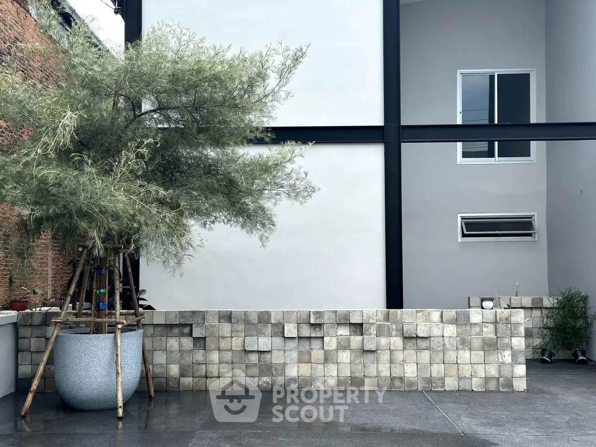 Modern exterior with minimalist design, featuring a sleek facade and contemporary landscaping.