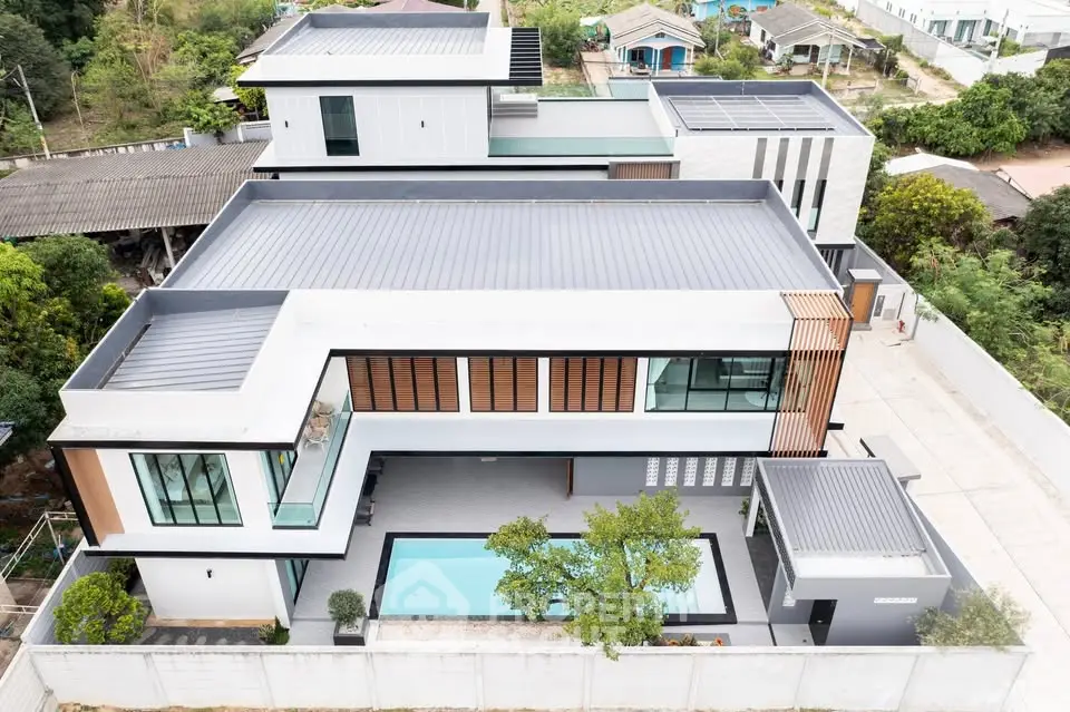 Luxurious modern villa with sleek design and private pool, offering stunning architectural elegance and spacious outdoor area.