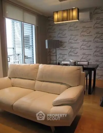 Modern living room with stylish decor and large windows