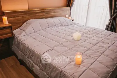Cozy bedroom with elegant decor and soft lighting, featuring a comfortable bed and stylish wooden accents.