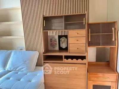 Stylish modern living room with elegant wooden furniture and cozy white sofa.