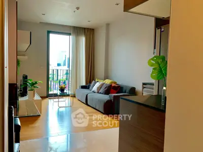 Modern living room with city view, cozy sofa, and stylish decor