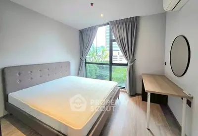 Modern bedroom with large window and minimalist decor