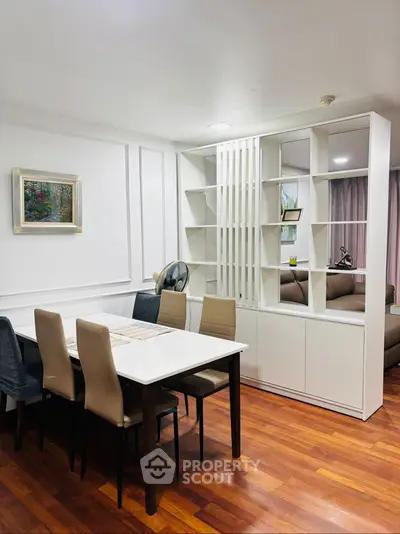 Elegant dining area with modern decor and stylish shelving unit
