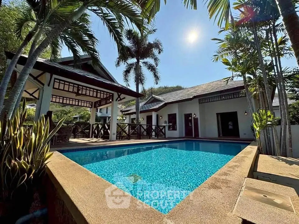 Luxurious tropical villa with private pool and lush garden, perfect for serene living.