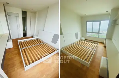Spacious bedroom with large window offering stunning views and ample natural light.