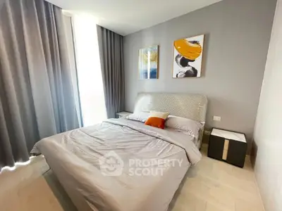 Modern bedroom with stylish decor and natural light