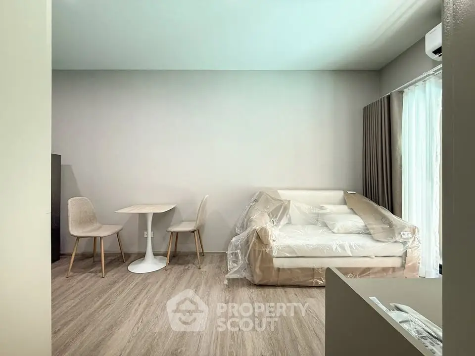 Modern living room with minimalist furniture and natural light