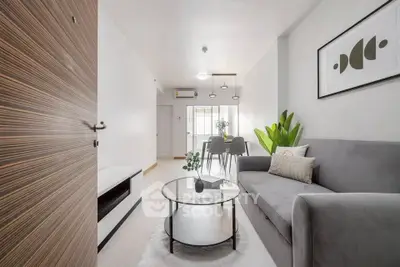 Modern living room with sleek furniture and stylish decor in a bright apartment.