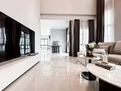 Spacious modern living room with sleek design and large windows for natural light.