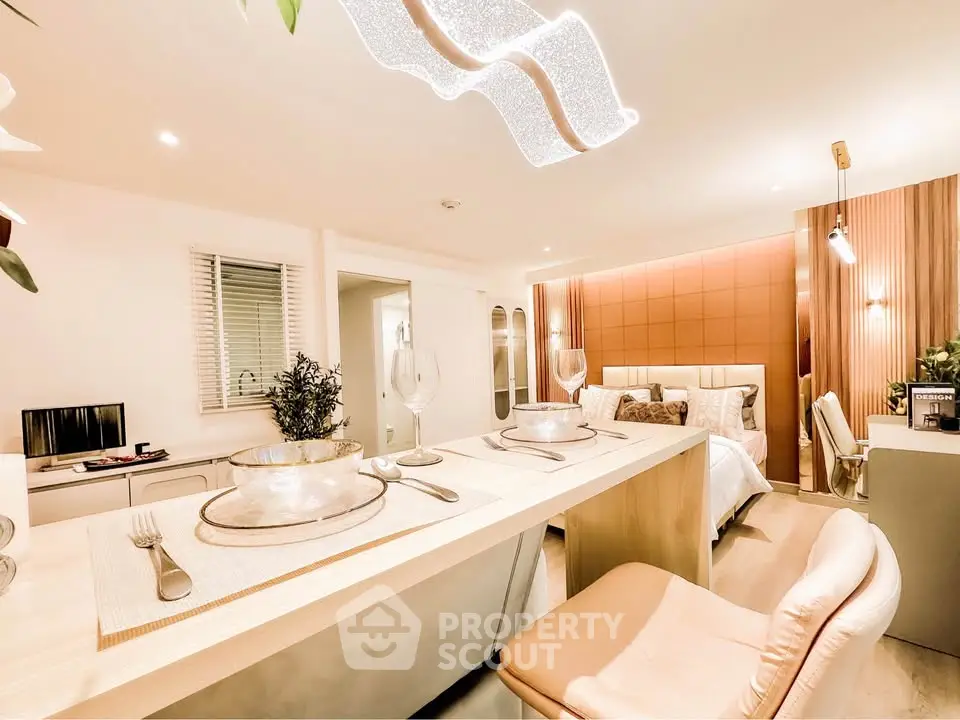 Luxurious open-plan bedroom with elegant dining area and modern decor