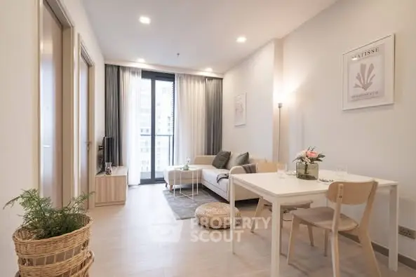 Modern living room with stylish decor and natural light in a cozy apartment.