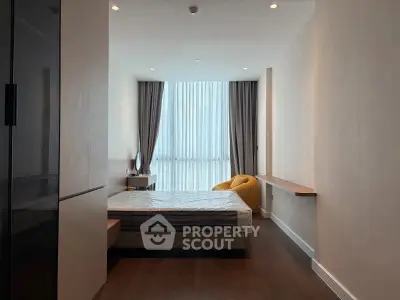 Modern bedroom with floor-to-ceiling windows and minimalist design
