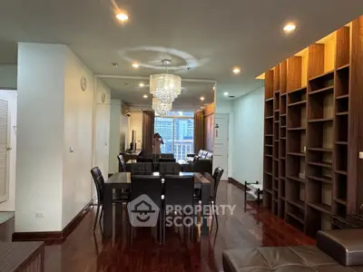 Spacious living room with elegant dining area and modern lighting