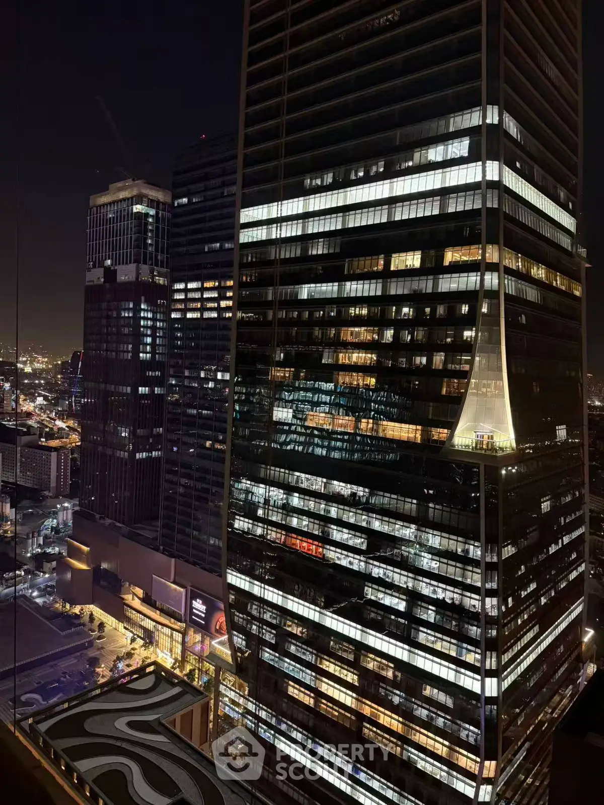 Stunning night view of modern skyscrapers in bustling cityscape