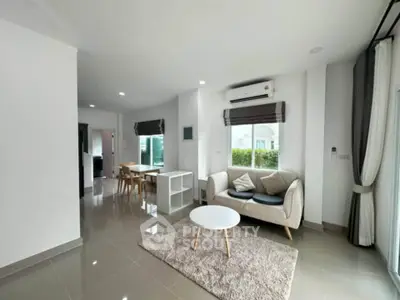Spacious modern living room with sleek furniture and natural light