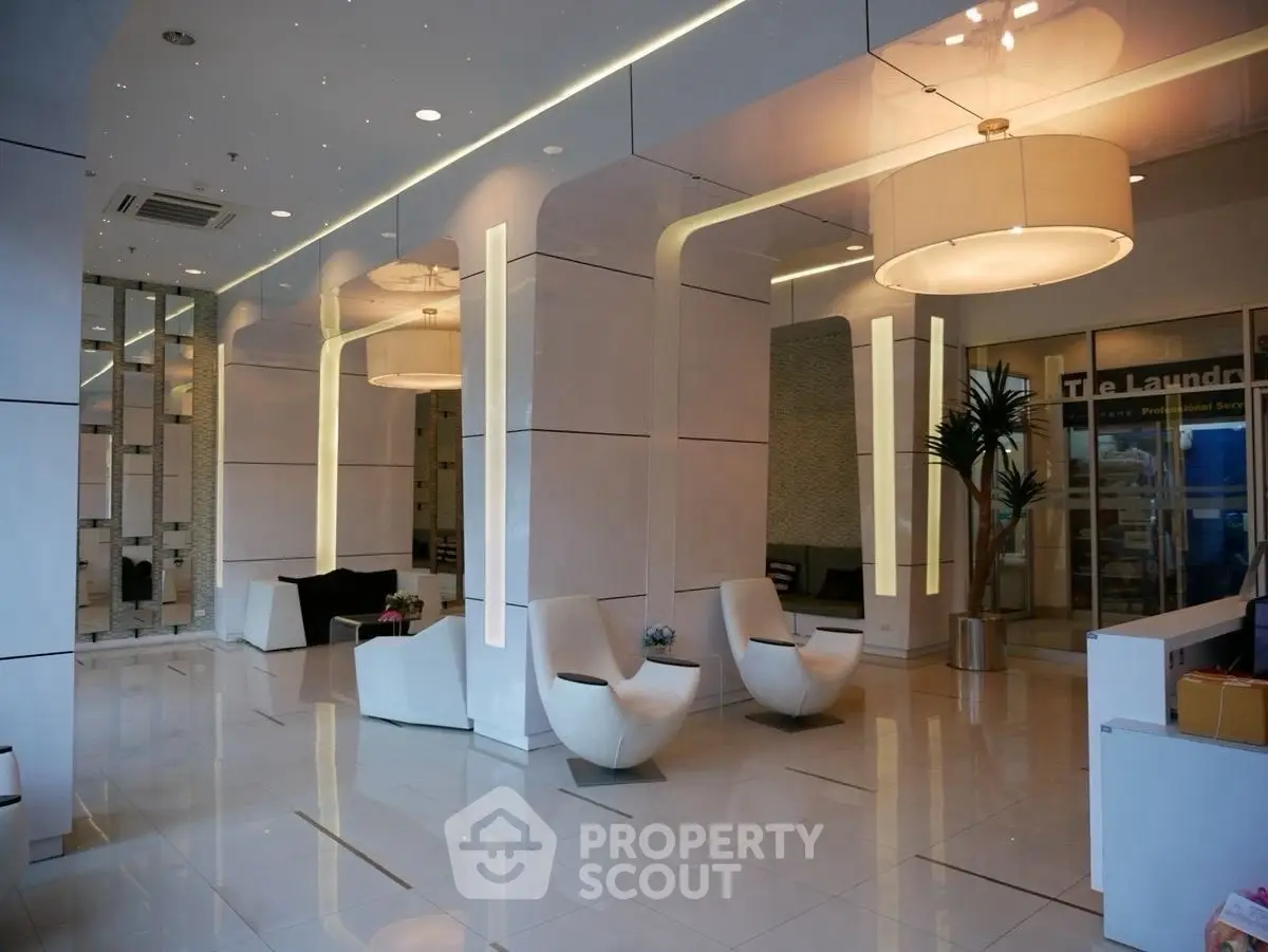 Luxurious modern lobby with sleek white decor and stylish seating