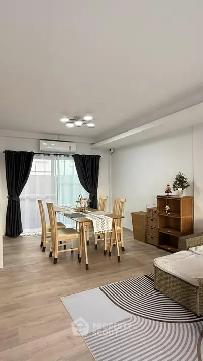 Spacious modern living room with elegant dining area and stylish decor