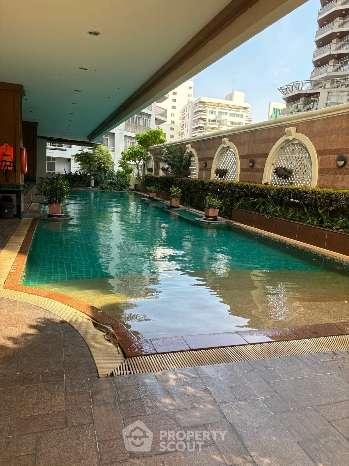 Luxurious covered swimming pool area in upscale residential complex