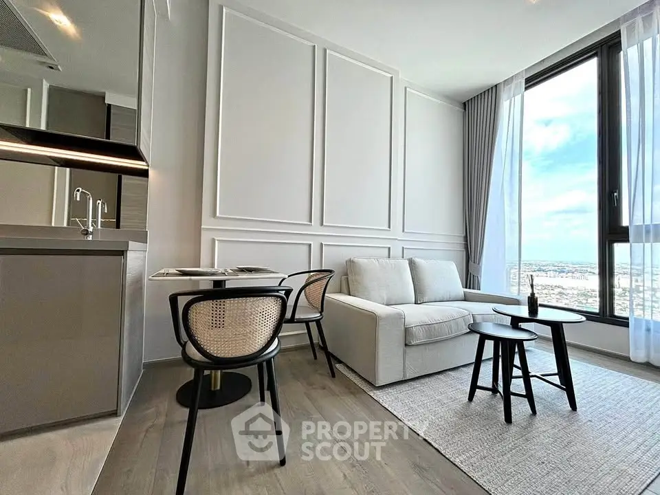 Modern living room with elegant decor and stunning city view through large windows.