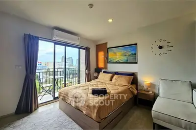 Modern bedroom with balcony view in urban apartment
