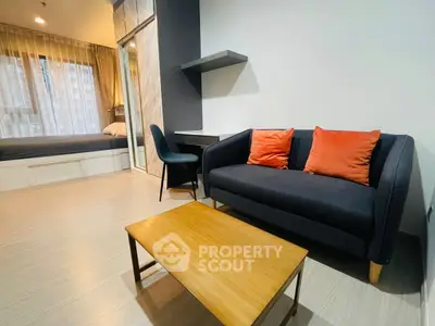Modern studio apartment with cozy living area and stylish decor
