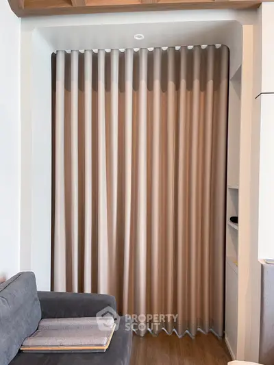 Cozy living room corner with elegant curtains and modern sofa