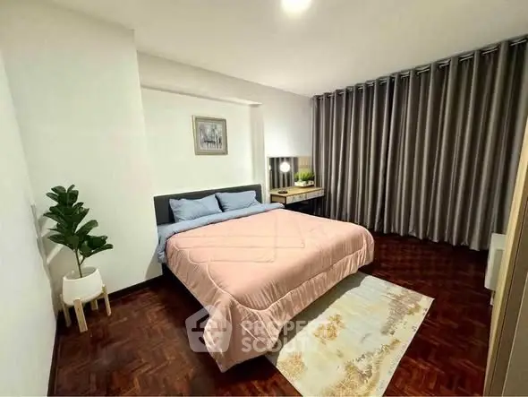 Spacious bedroom with elegant decor and cozy ambiance