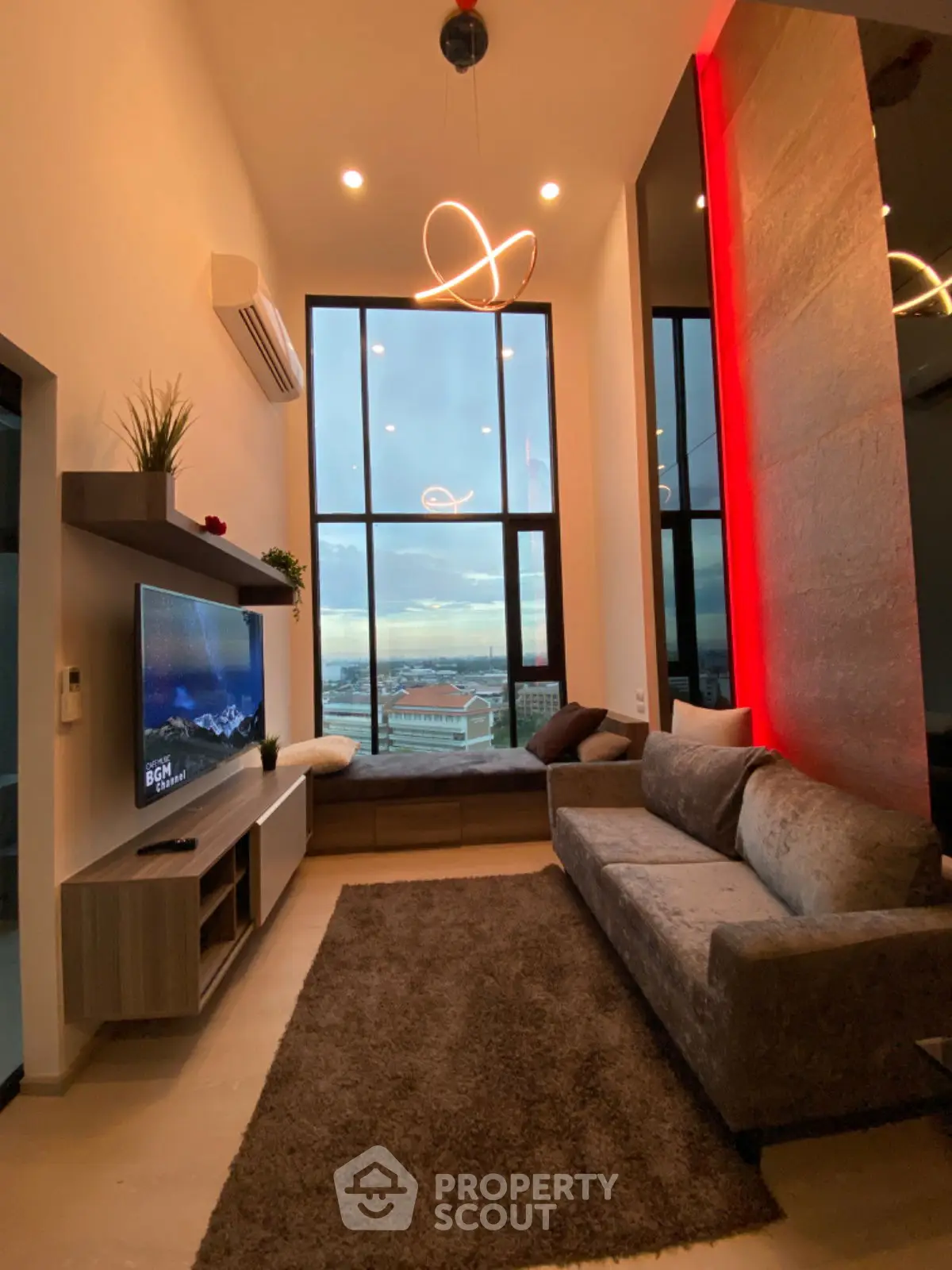 Modern living room with high ceilings and city view