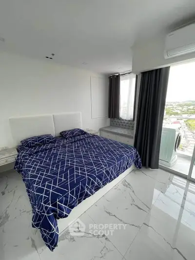 Modern bedroom with marble flooring and large window offering scenic views.