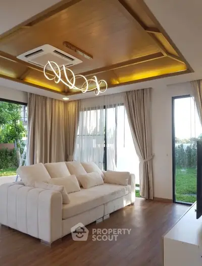 Luxurious living room with elegant lighting and garden view