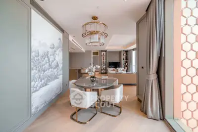 Luxurious modern living room with elegant decor and large windows offering natural light.
