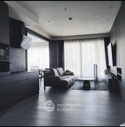 Modern living room with sleek design and floor-to-ceiling windows