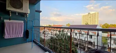 Charming balcony with city view, perfect for relaxation and enjoying sunsets.