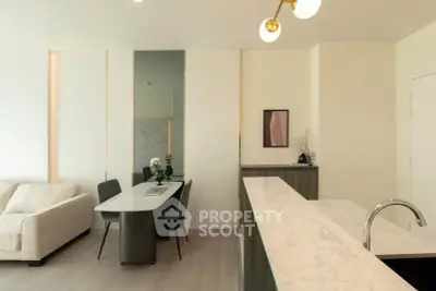 Modern open-plan living room with elegant dining area and stylish decor