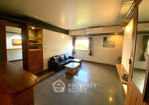 Spacious living room with modern decor and natural light
