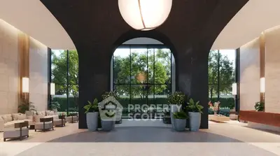 Luxurious modern building entrance with elegant design and lush greenery