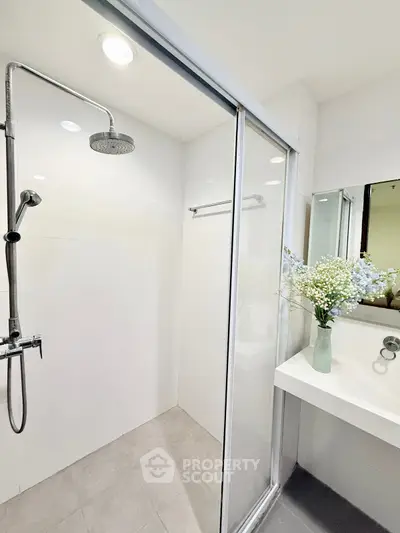 Modern bathroom with glass shower and elegant sink design