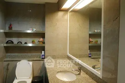 Modern bathroom with granite countertop and decorative shelves
