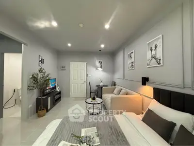 Modern studio apartment with cozy living area and stylish decor
