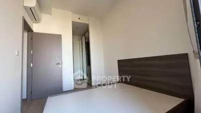 Modern minimalist bedroom with built-in wardrobe and air conditioning