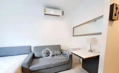 Modern studio apartment with sleek furniture and air conditioning