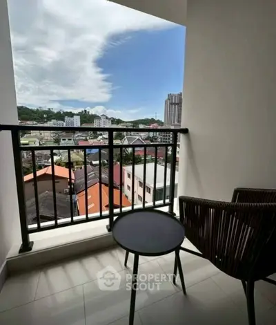Charming balcony with city view, perfect for relaxation and enjoying the skyline.