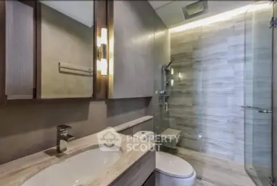 Modern bathroom with sleek design and glass shower enclosure