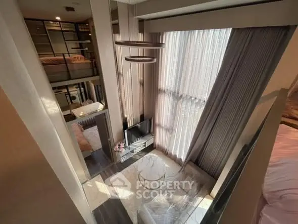 Luxurious loft-style living room with high ceilings and modern decor