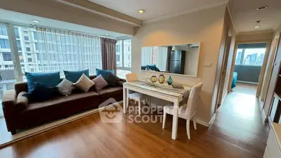 Spacious living room with elegant decor and city view, perfect for modern urban living.