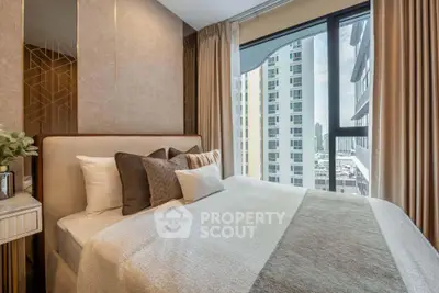 Luxurious bedroom with stunning city view in modern high-rise apartment