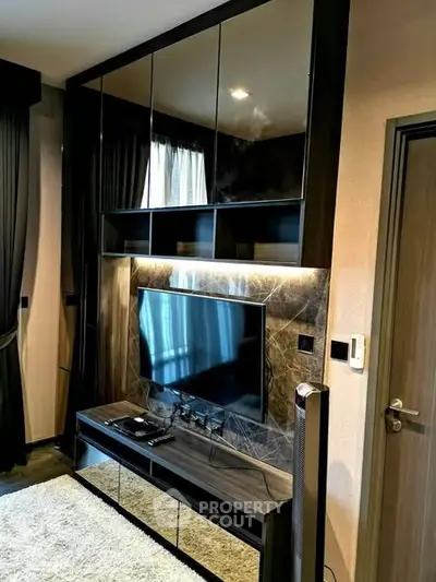Modern living room with sleek entertainment unit and stylish decor