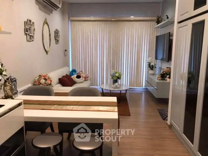 Charming living room with modern decor and ample natural light